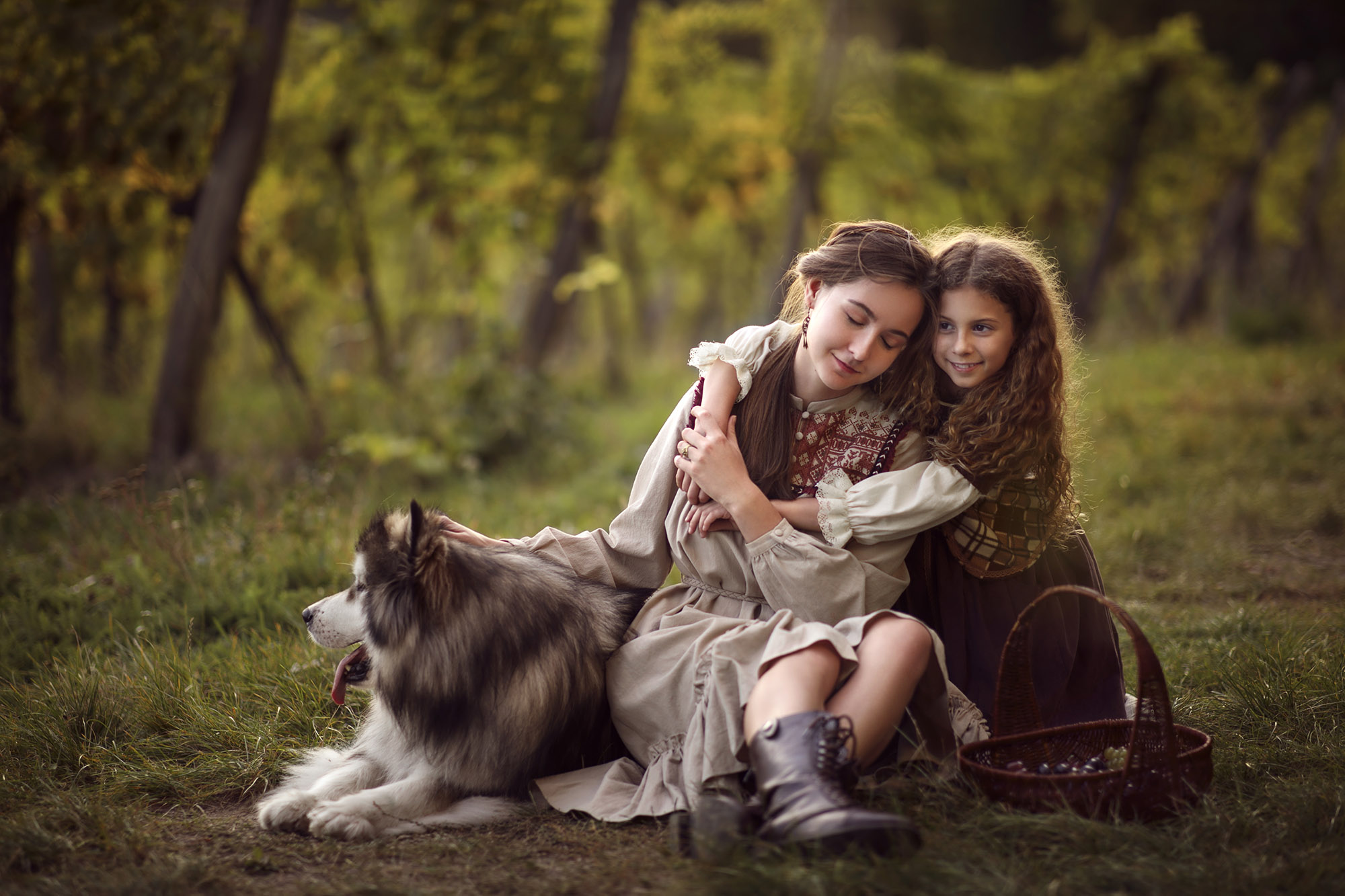 Two girls with a dog in vineyard in Vienna