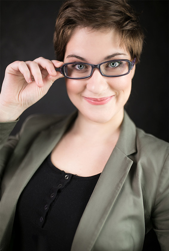 Businesswoman holding her glasses