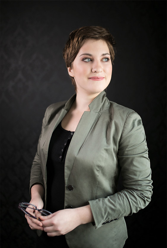 Portrait of a business woman on black background