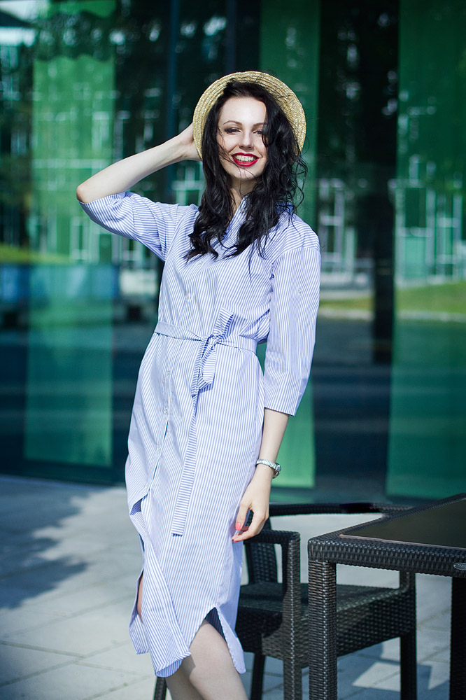 Girl in a long dress and straw hat