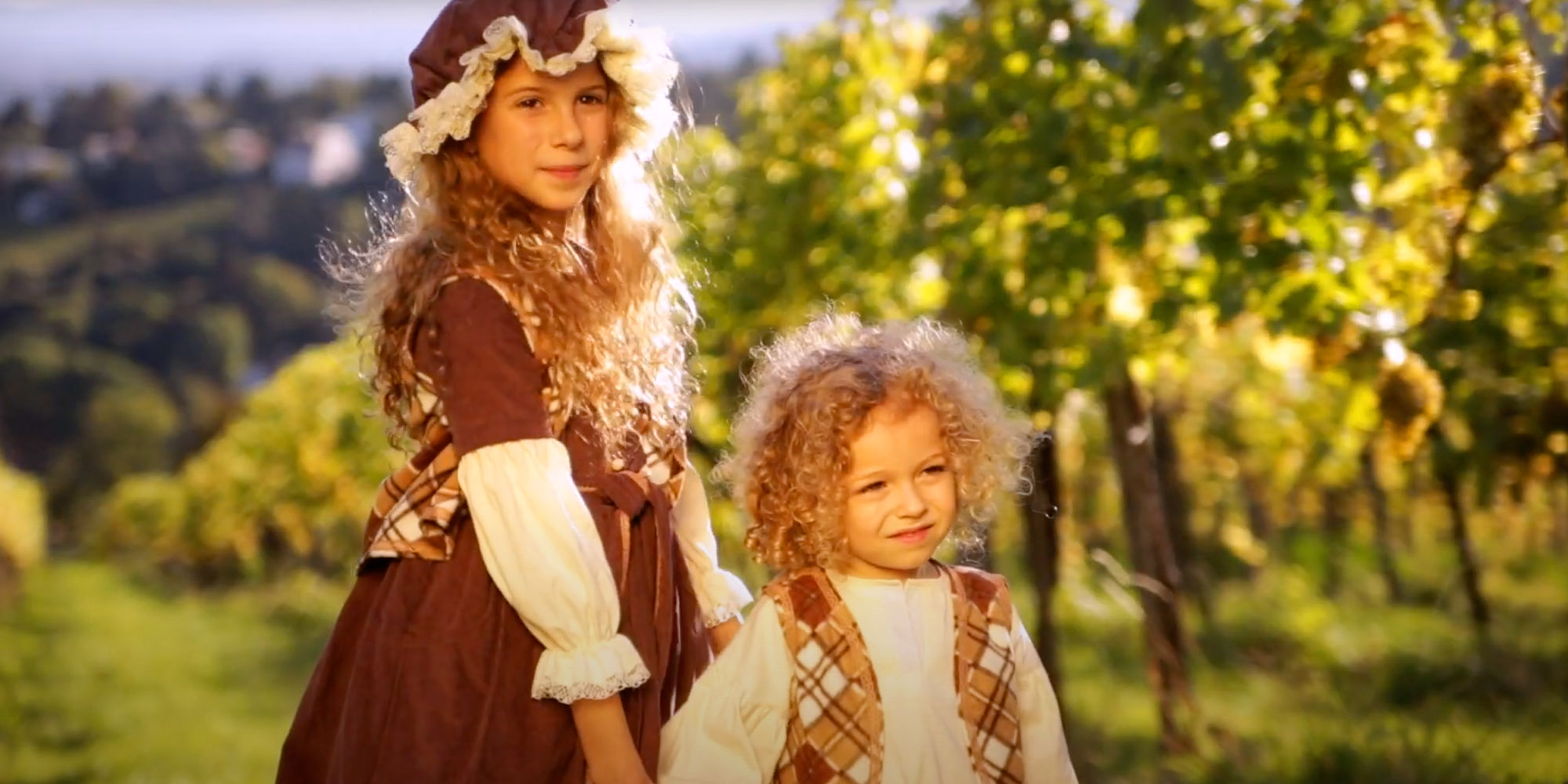 Two kids in vineyard